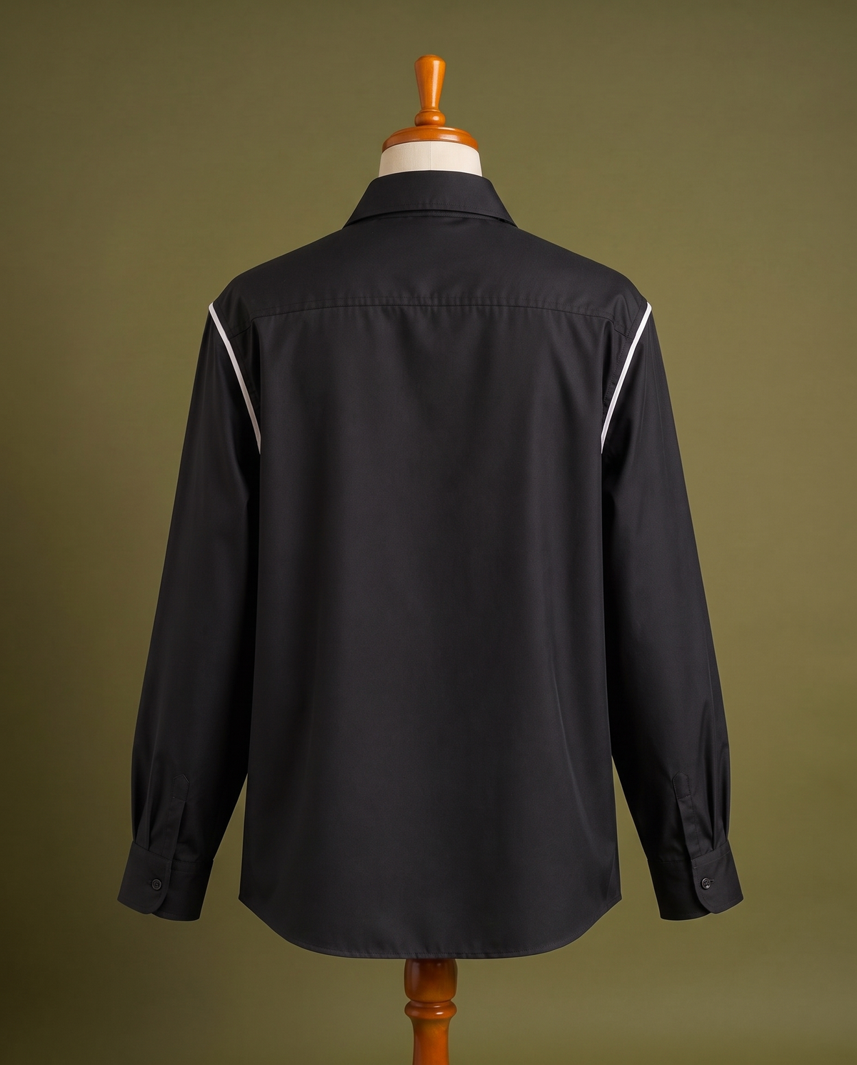 Black shirt with white contrast piping, back